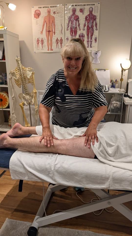 Villy providing a leg massage at Angel Touch Therapy in Harrogate
